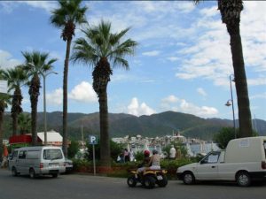 tourists in marmaris and hills across